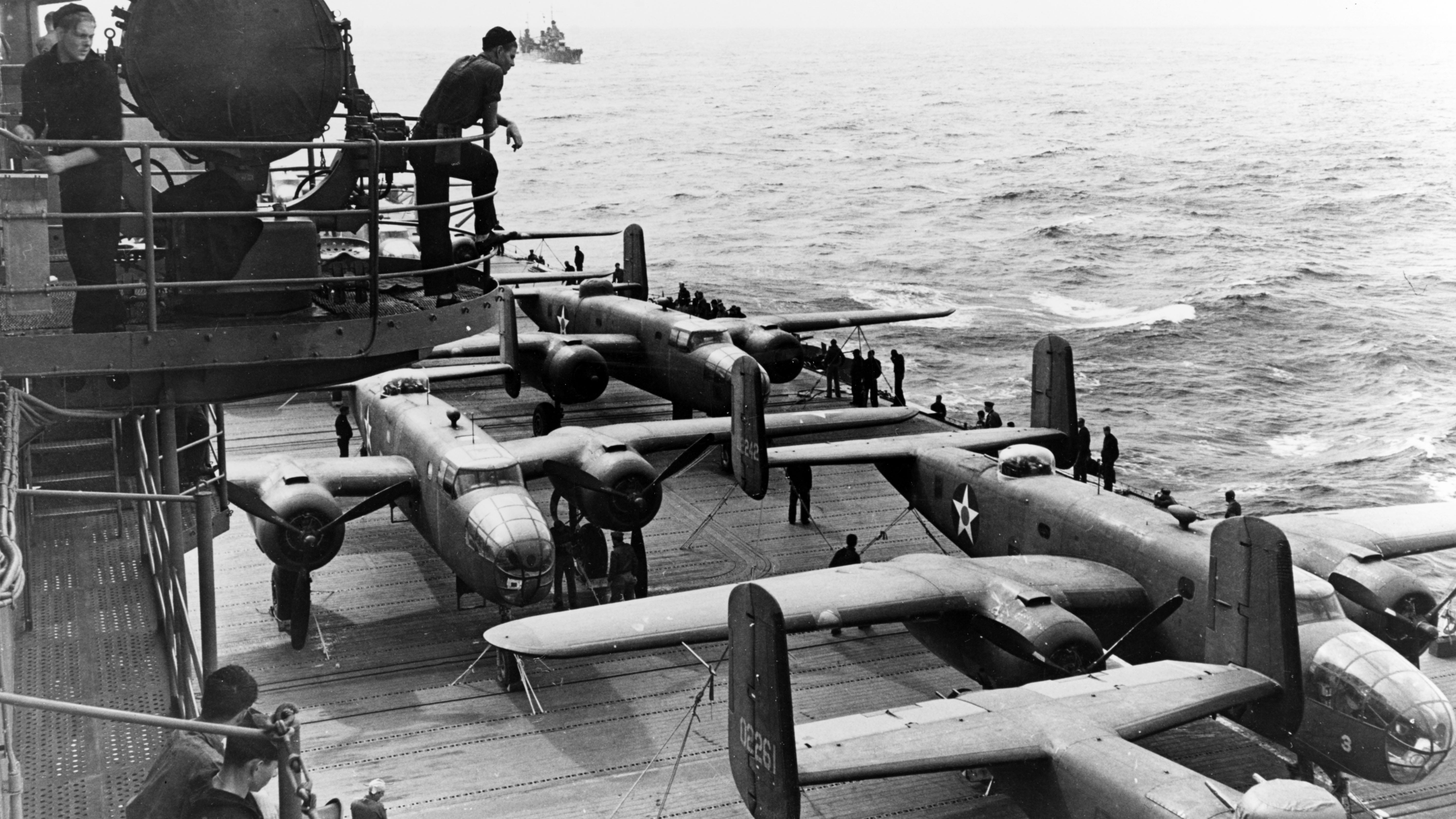U.S. Army bombers crowd the deck of the aircraft carrier Hornet, as a U.S. Navy task force steams across the north Pacific on a mission to avenge the December 7, 1941 Japanese attack on Pearl Harbor. (photo credit: National Archives)